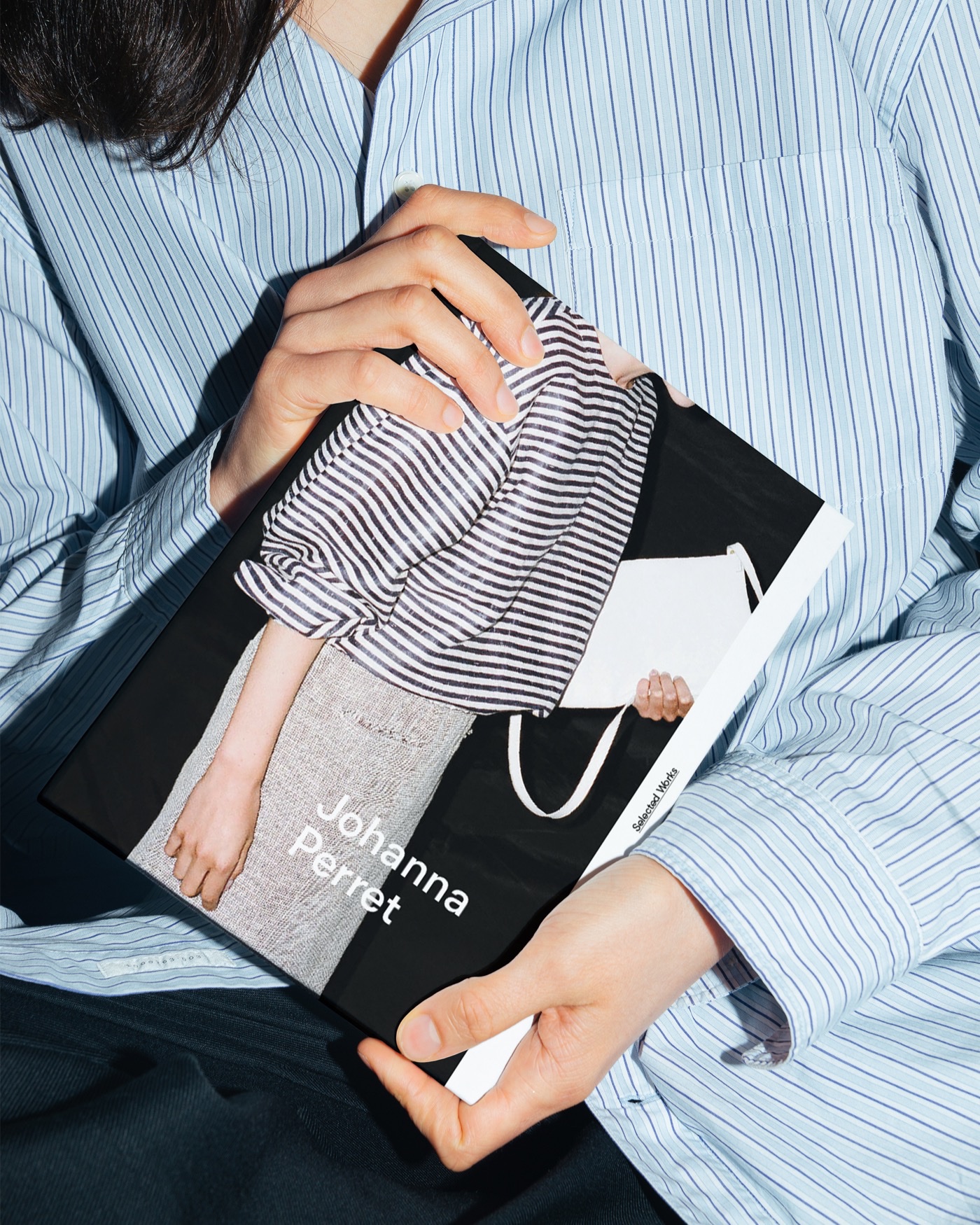 Hands holding the Johanna Perret book