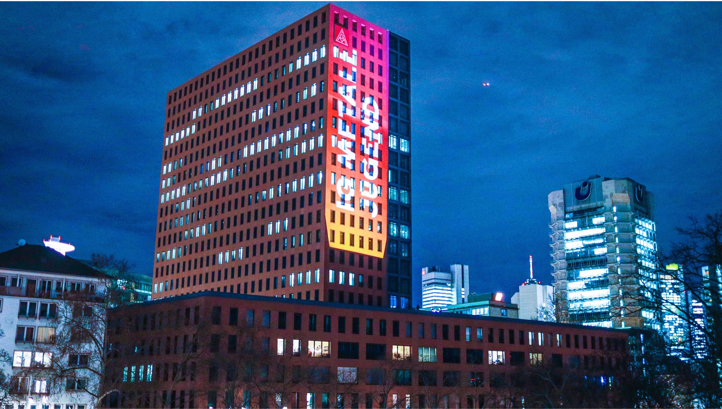 Organice projection on an office tower at night